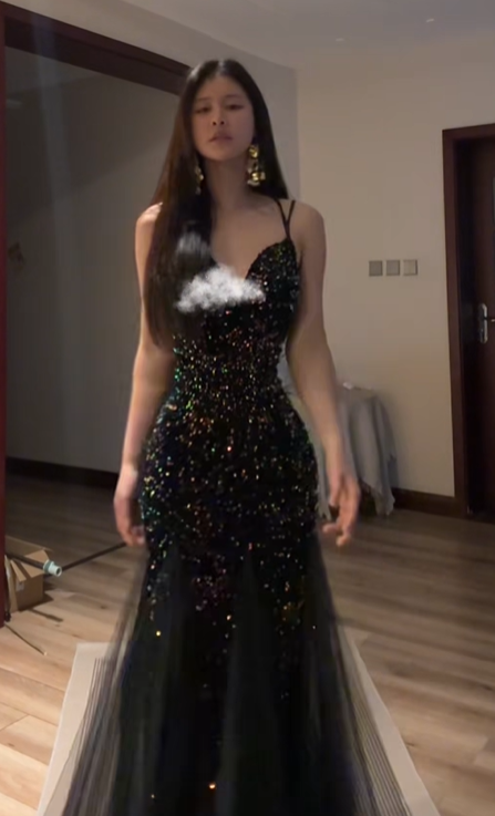 Sexy ball gown with black halter neck, fitted waist, and sequined fishtail skirt. R8065