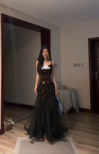 Sexy ball gown with black halter neck, fitted waist, and sequined fishtail skirt. R8065