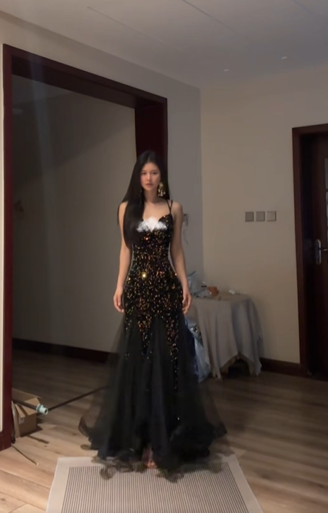 Sexy ball gown with black halter neck, fitted waist, and sequined fishtail skirt. R8065