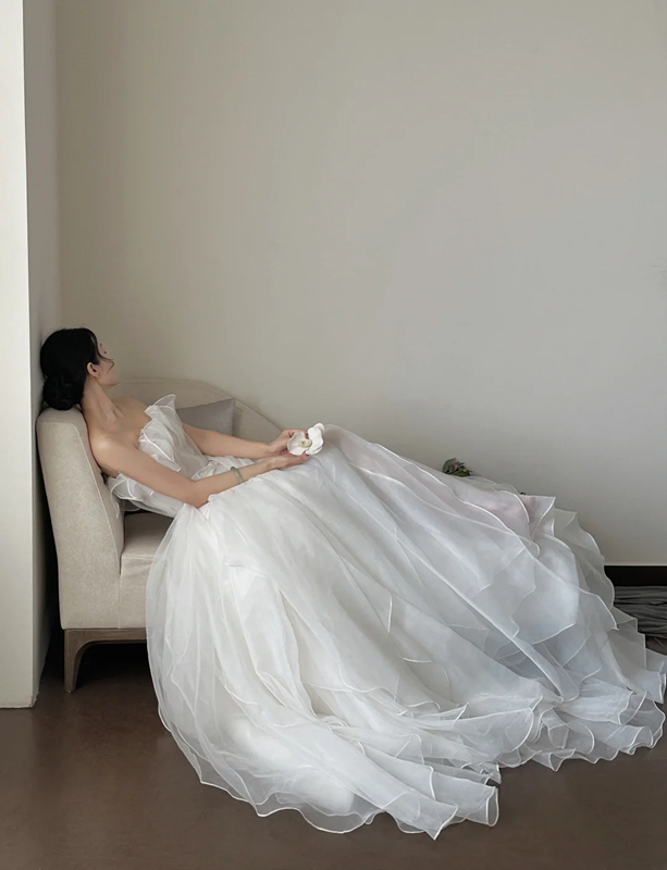 White strapless waist‑cinched slim‑fit ball gown with a full ruffled skirt, wedding dress R8008