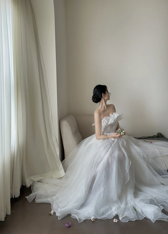 White strapless waist‑cinched slim‑fit ball gown with a full ruffled skirt, wedding dress R8008