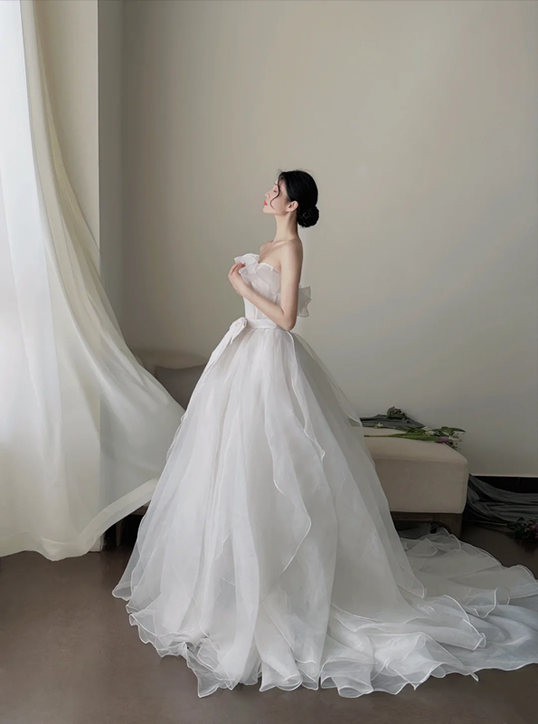 White strapless waist‑cinched slim‑fit ball gown with a full ruffled skirt, wedding dress R8008