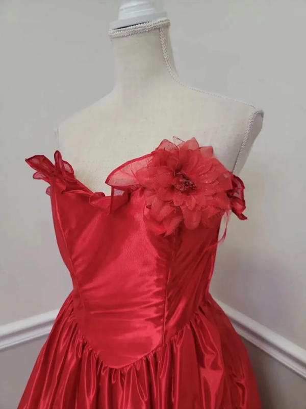 Red strapless ball gown with a cinched waist and an asymmetrical skirt; bridal gown R7297