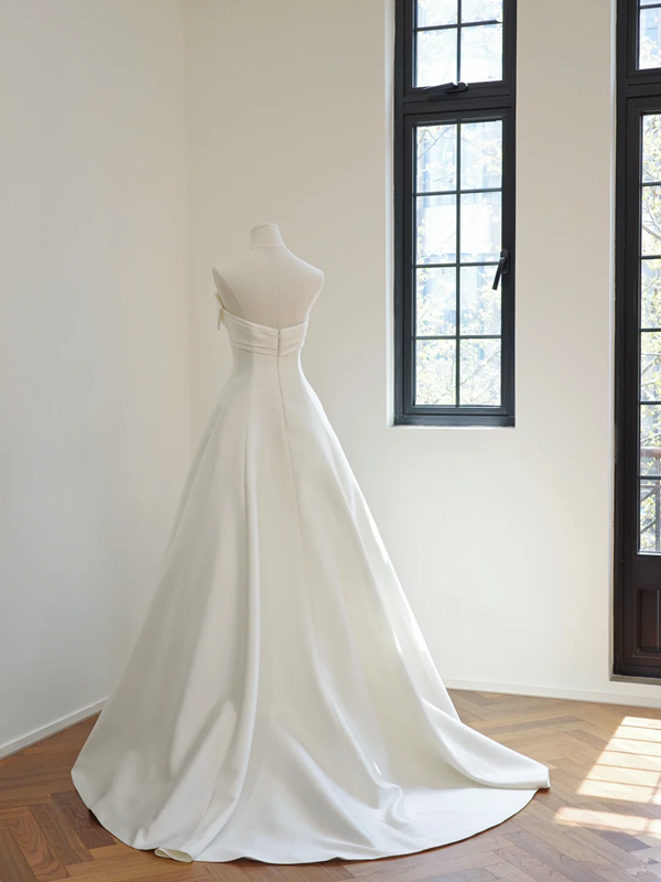 White strapless, fitted, long ball gown with a full skirt; bridal gown R8501