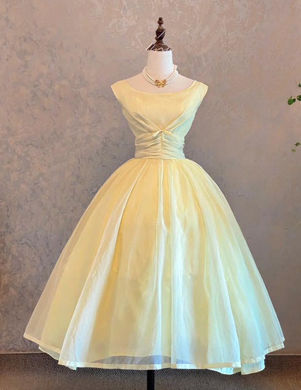 Light yellow sleeveless ball gown with a cinched waist and a voluminous puffy skirt; bridal gown R7303