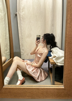 Champagne pink spaghetti strap, waist‑cinching, short ball gown with a fluffy, ruffled bud‑style skirt R7999