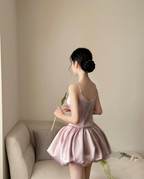 Champagne pink spaghetti strap, waist‑cinching, short ball gown with a fluffy, ruffled bud‑style skirt R7999