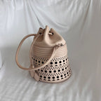 Alaia Laser-cut Corset Bucket Top-handle Bag In Galet