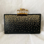 Alexander Mcqueen Skull Four-Ring Clutch Bag