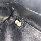 Chanel black quilted patent leather flap bag